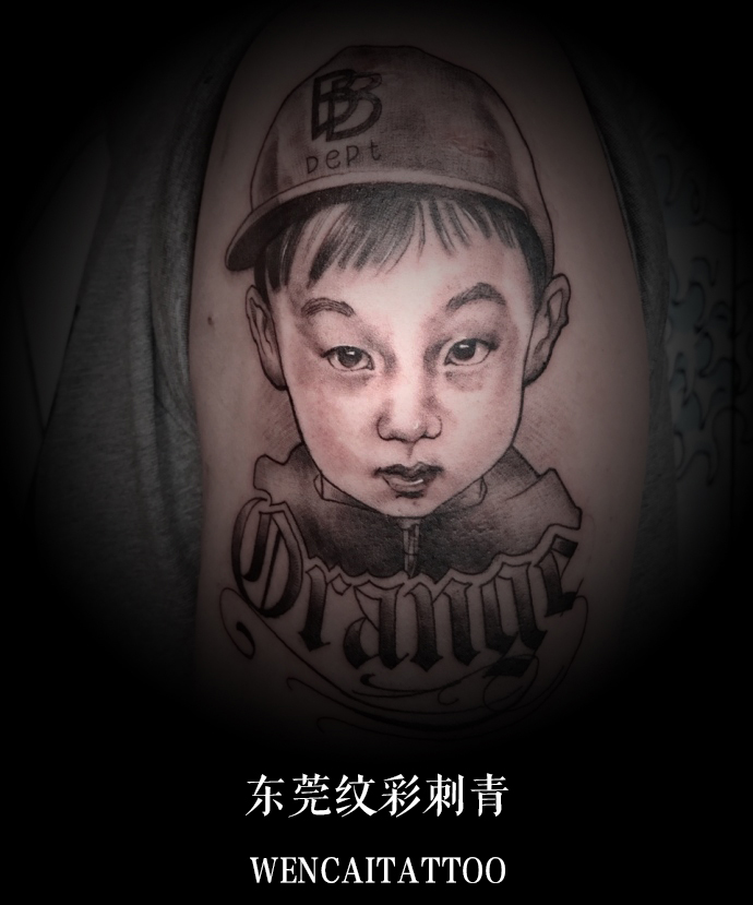 东莞的冷先生大臂可爱儿子肖像纹身